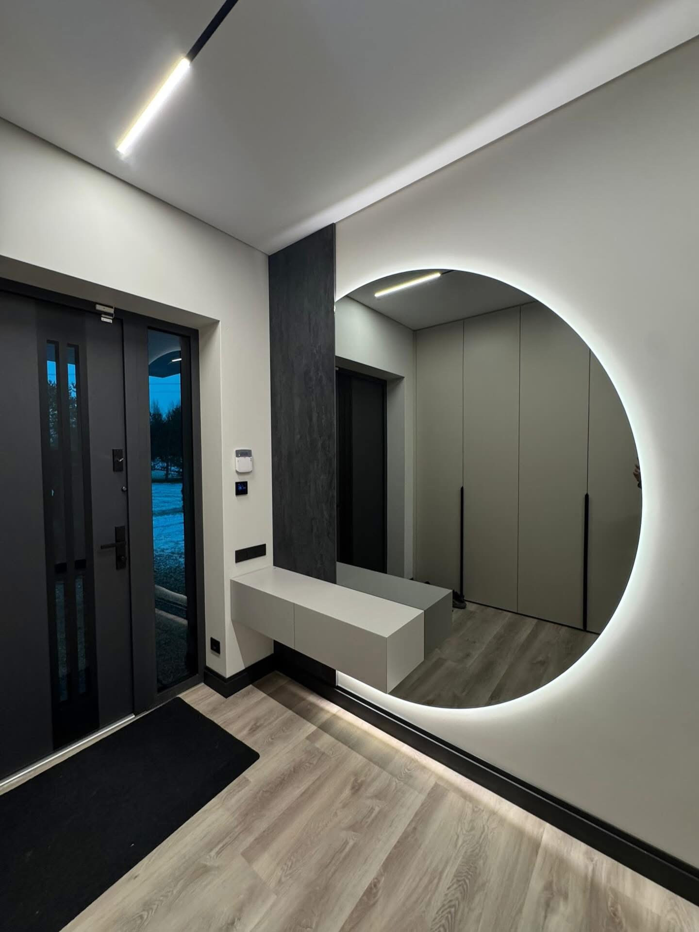 Console with round illuminated mirror